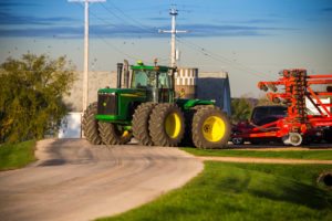 picture of a John Deere tractor on a farm site