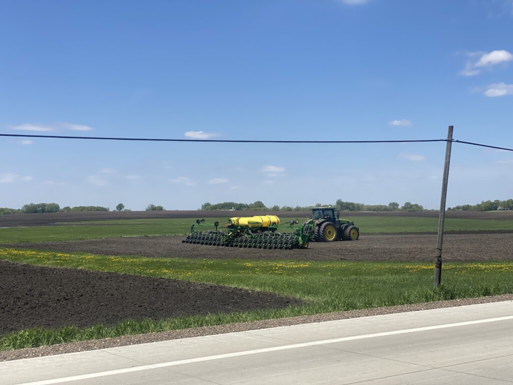 tractor in field next to power lines