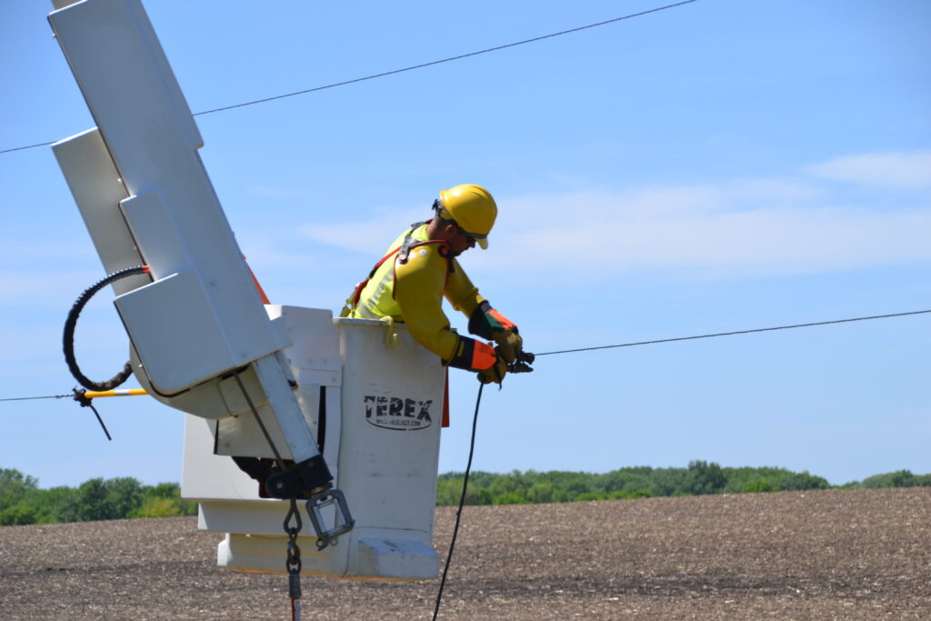 Photo of a lineworker making a repair