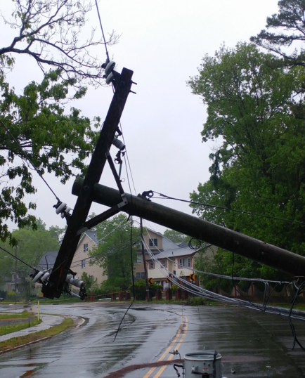 powerline pole fallen down into residential street